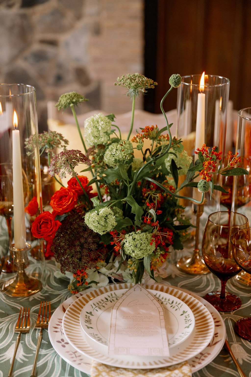  Candlelit place setting with spring centerpiece and arched menu at The Little Chapel at Haven Ridge 