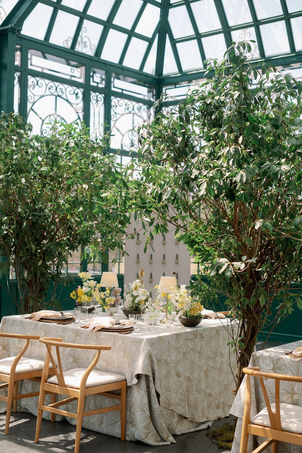  Reception table beneath the glass dome and greenery in the Solarium at The Little Chapel at Haven Ridge, Winston-Salem 