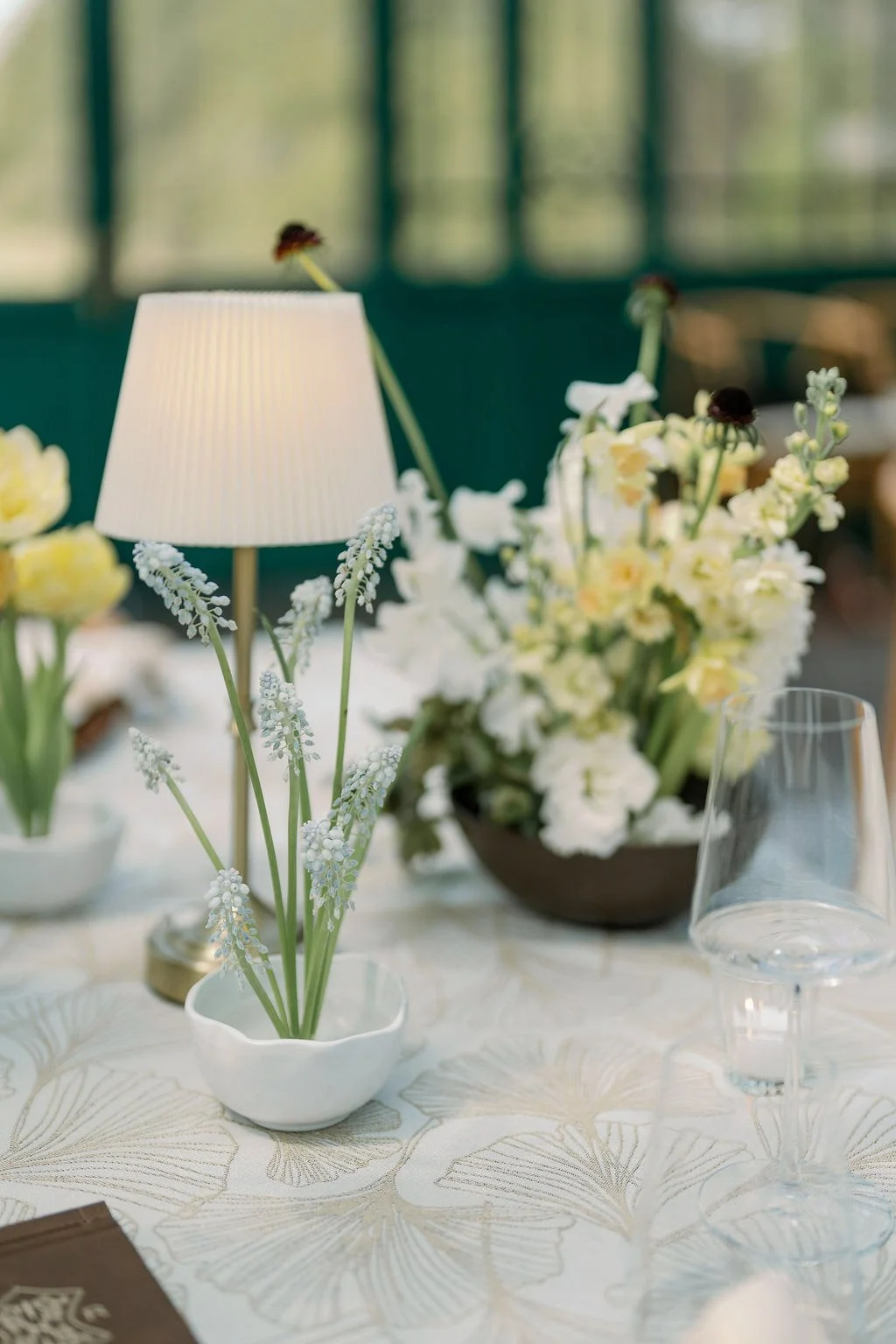  Pleated lamp and spring florals on ginkgo linen in the Solarium at The Little Chapel at Haven Ridge 