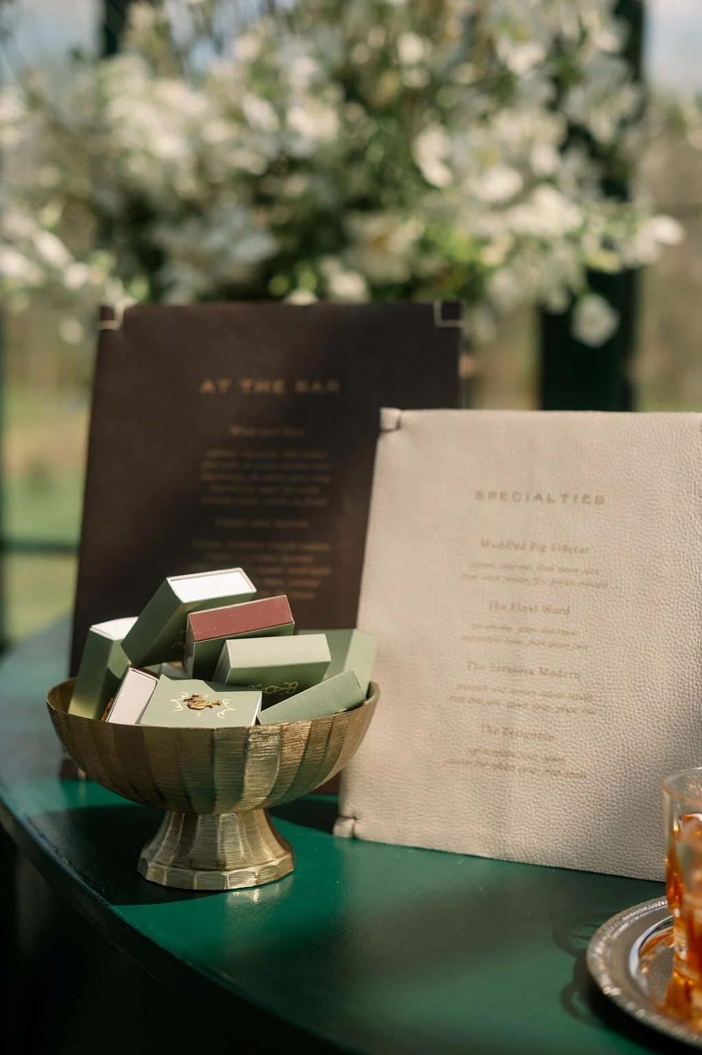  Bar menu and matchbox details on the green bar in the Solarium at The Little Chapel at Haven Ridge   