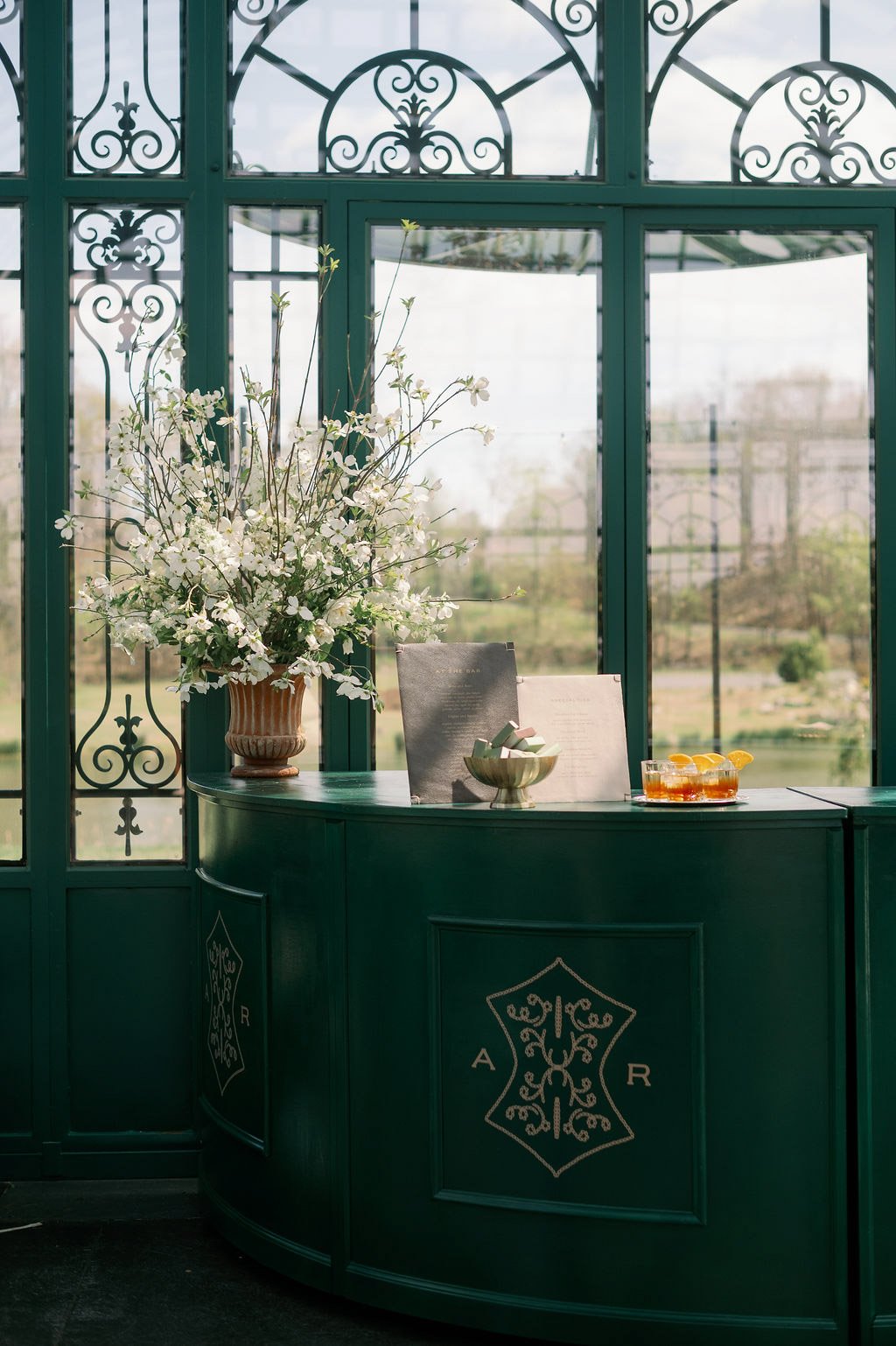  Monogrammed green bar with spring florals and cocktails in the Solarium at The Little Chapel at Haven Ridge, Winston-Salem 