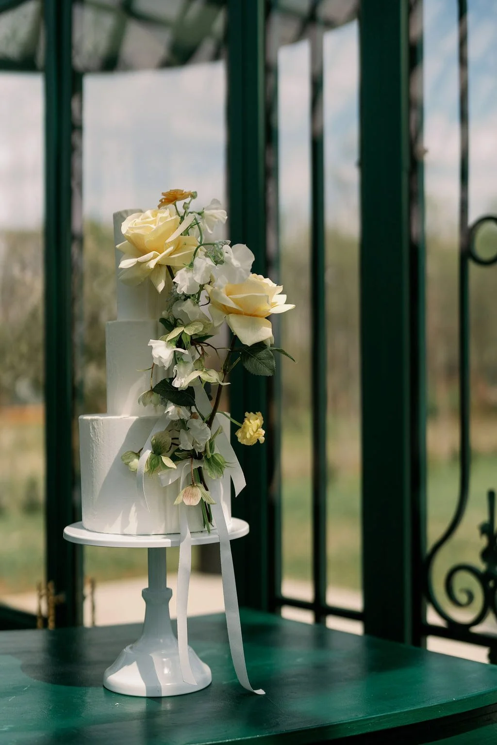  Wedding cake with yellow roses in the Solarium at The Little Chapel at Haven Ridge, Winston-Salem 