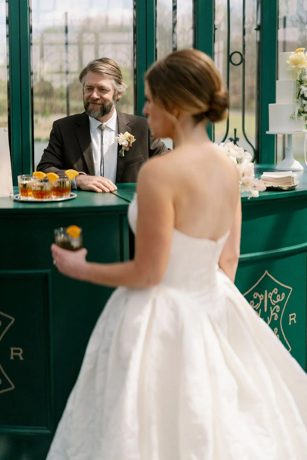  Couple sharing cocktails at the green bar in the Solarium at The Little Chapel at Haven Ridge 