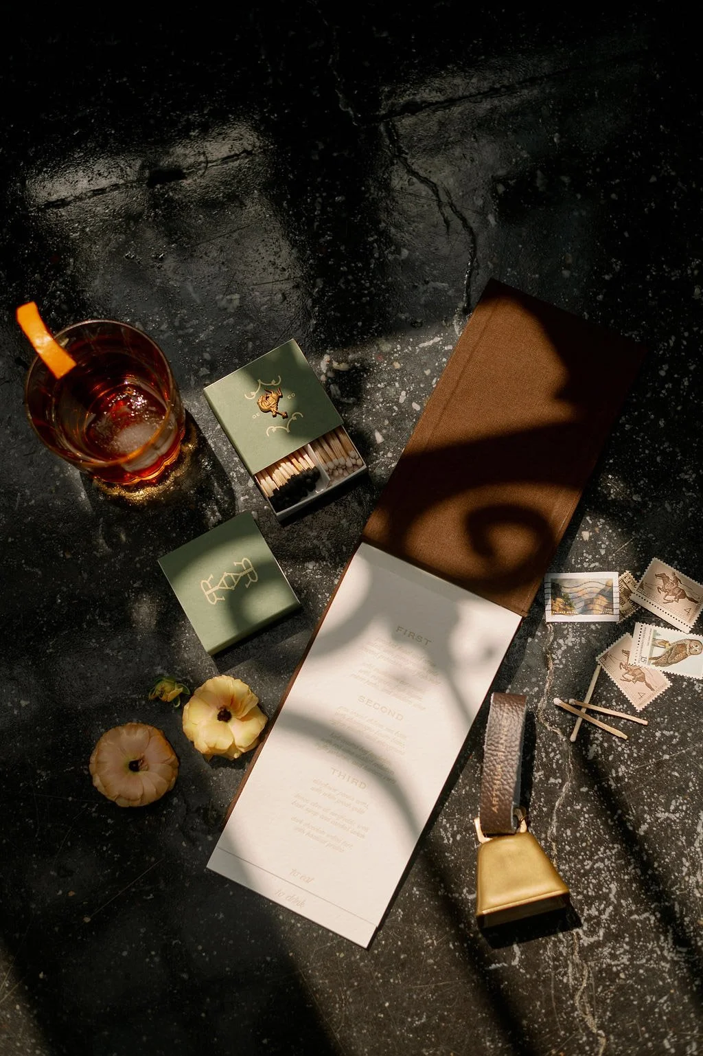  Wedding stationery, signature cocktail, and detail flat lay at The Little Chapel at Haven Ridge 