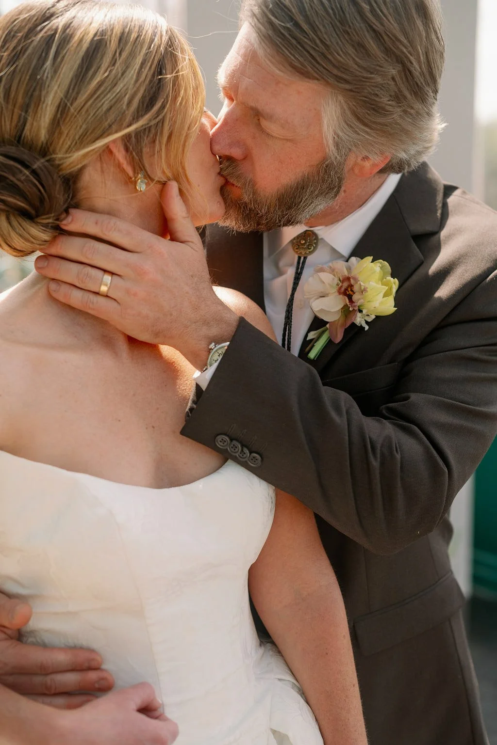  Couple sharing a kiss in the Solarium at The Little Chapel at Haven Ridge, Winston-Salem NC wedding 