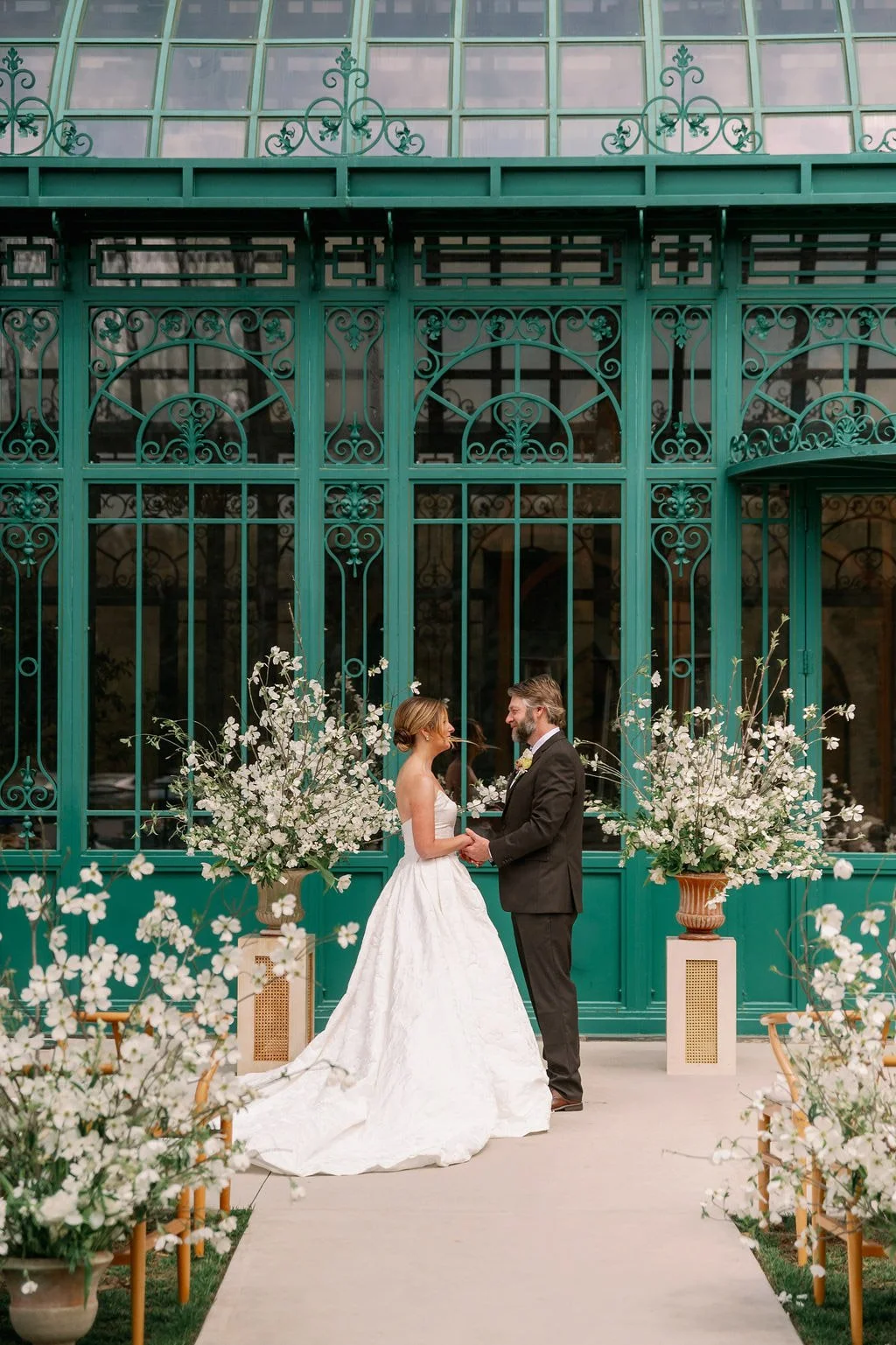 Couple at the outdoor ceremony aisle outside the Solarium at The Little Chapel at Haven Ridge 