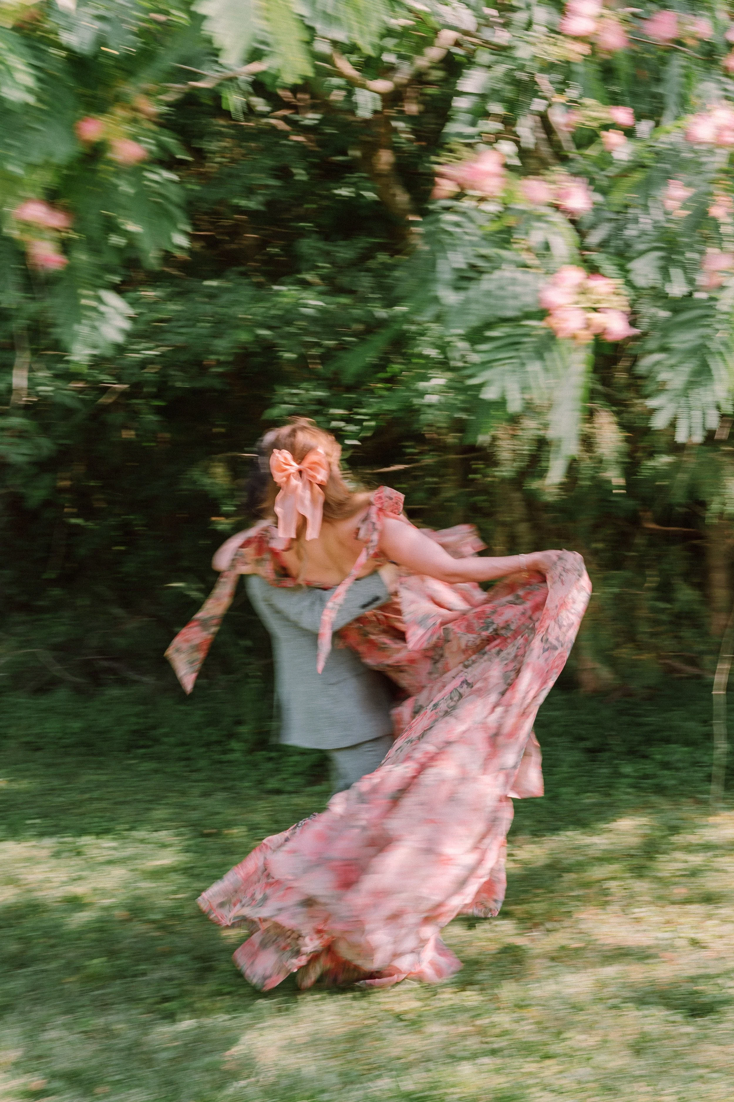 Backyard Wedding Reception in North Carolina | Bride Twirling in Pink Floral Gown
