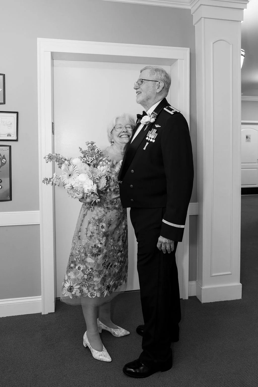Bride and groom sharing a joyful moment after their intimate wedding ceremony in North Carolina, groom wearing military dress uniform