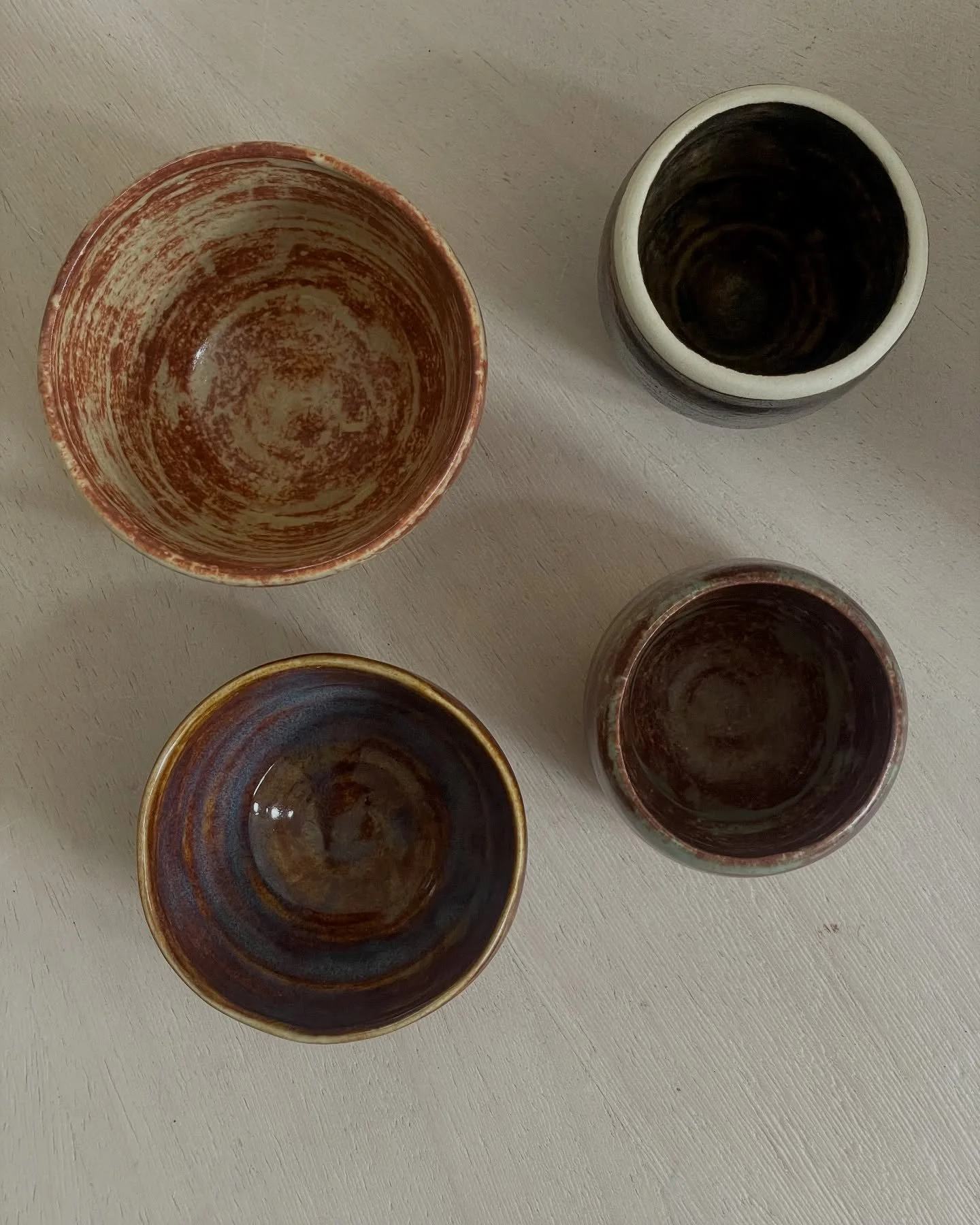My 18 year old and I took a four week pottery class this summer - a Christmas gift to me. It was quite fun and we each managed to make few vessels. Mine (these) are all wee-sized because, well, lack of skills. :)