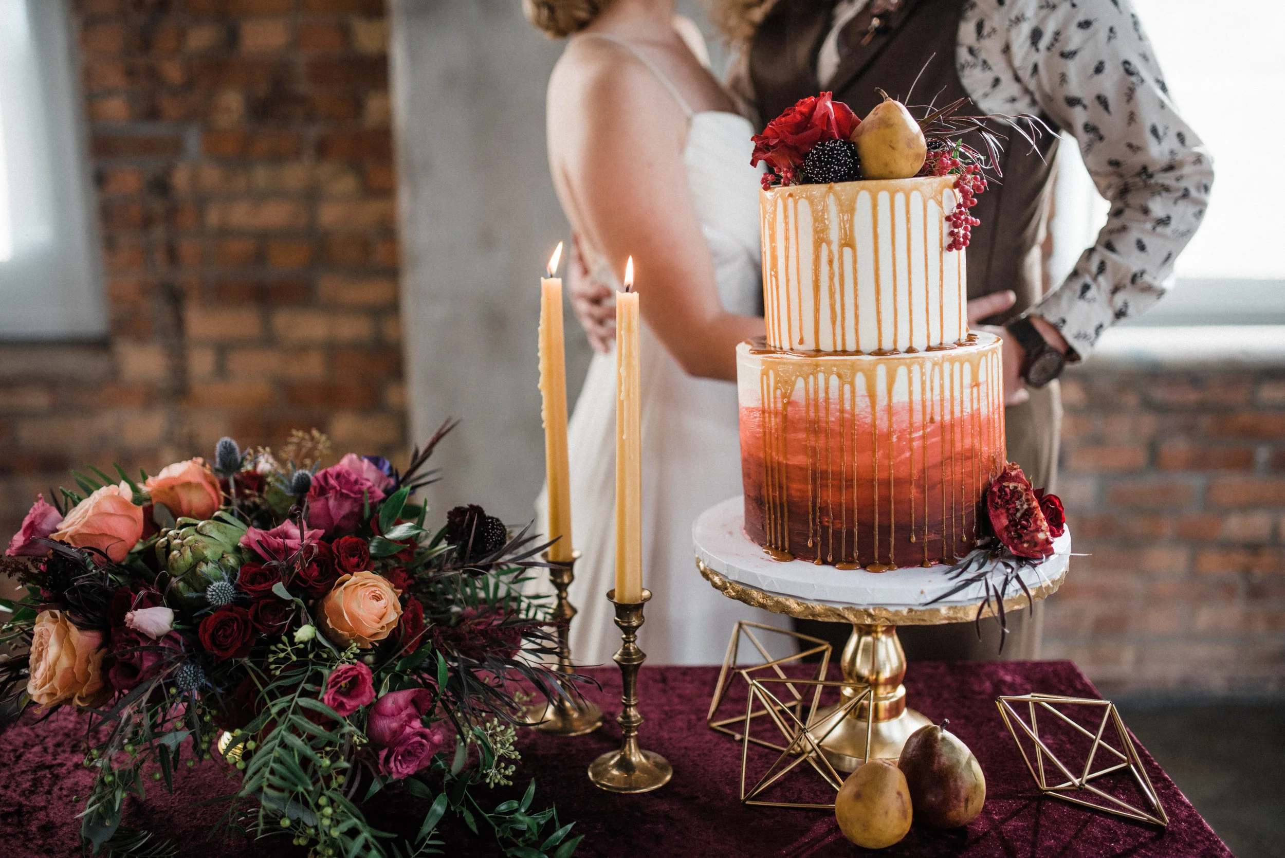 Flower arrangements by The Flower Man, decor from Something Old Dayton, planned and styled by Perry Rose Media, and photographed by Chelsea Hall. Wedding dress from Celia Grace. Shot at Steam Plant in Dayton.