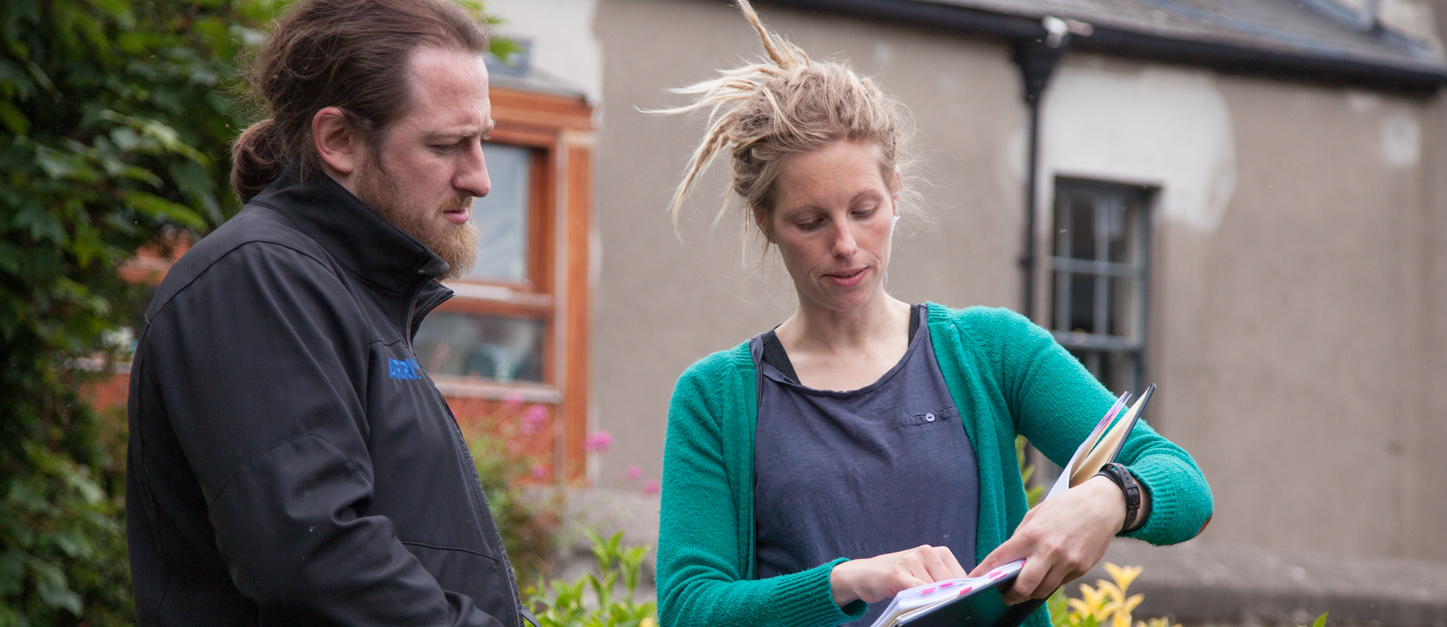 Producer Michael Donnelly V and Assistant Director Sonja Otto in discussion on set.