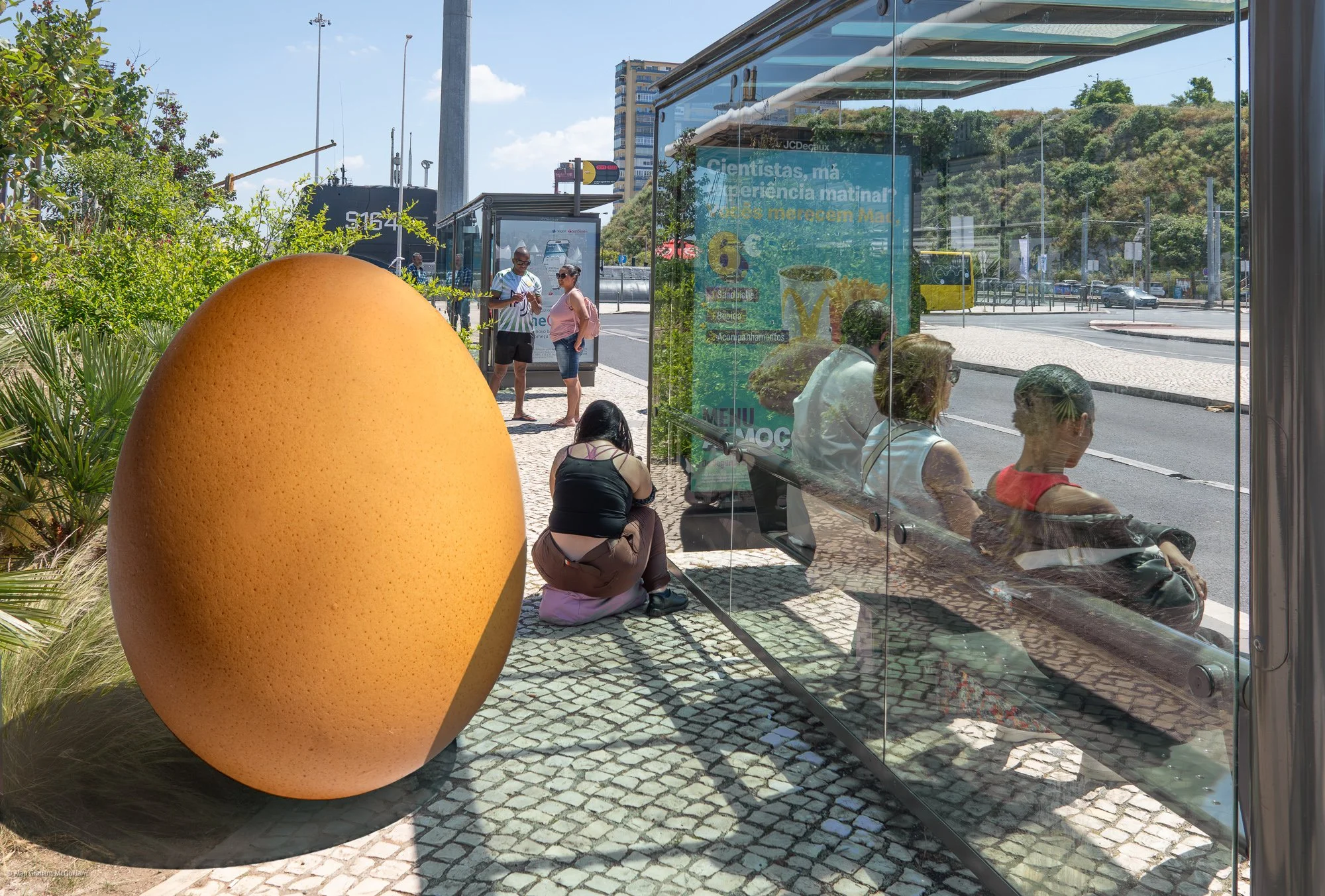 Fantasy Egg Waiting at Bus Stop, Lisbon, Portugal, 2025