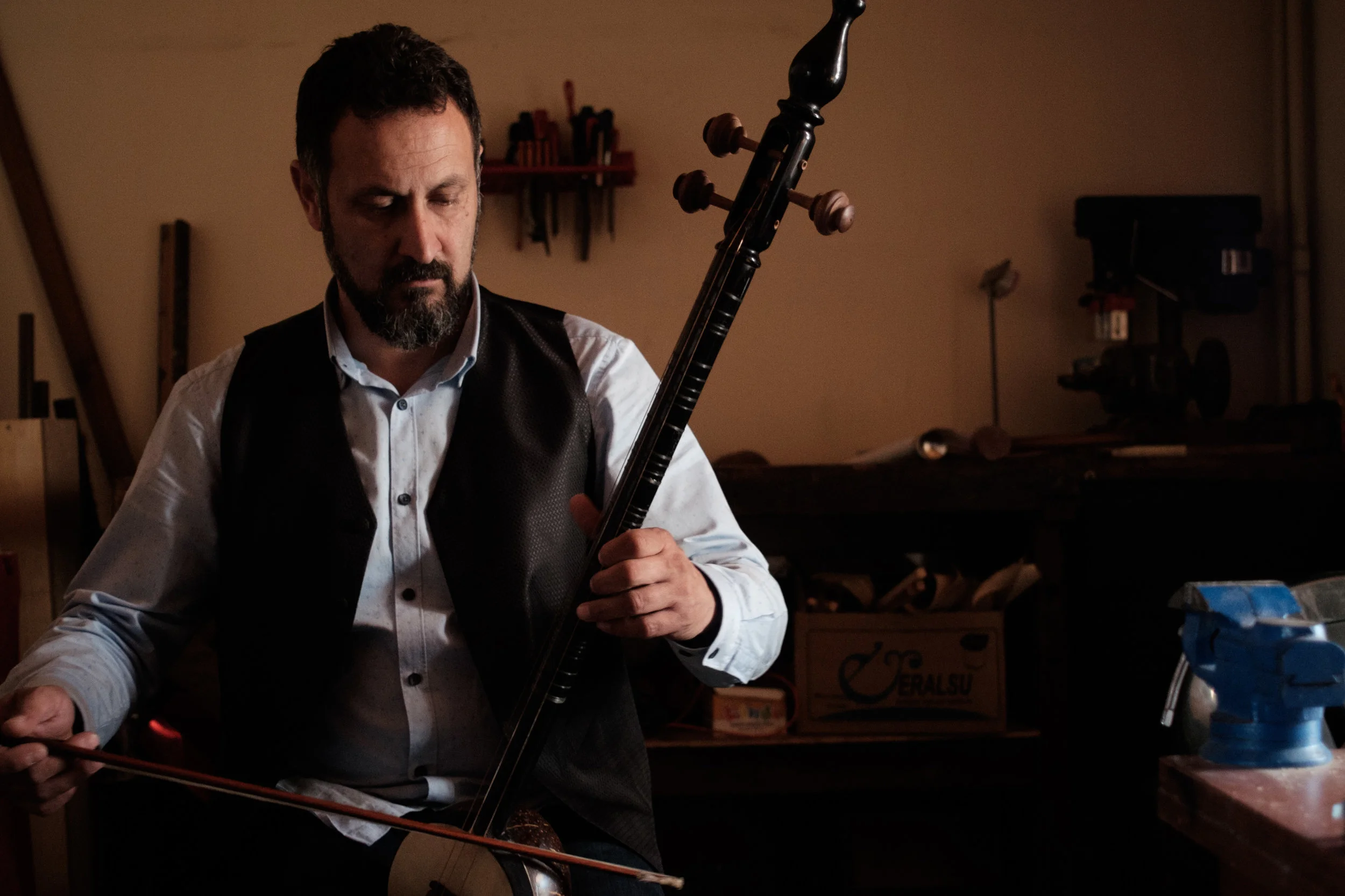 Rebab maker and instrumentalist in workshop, Konya