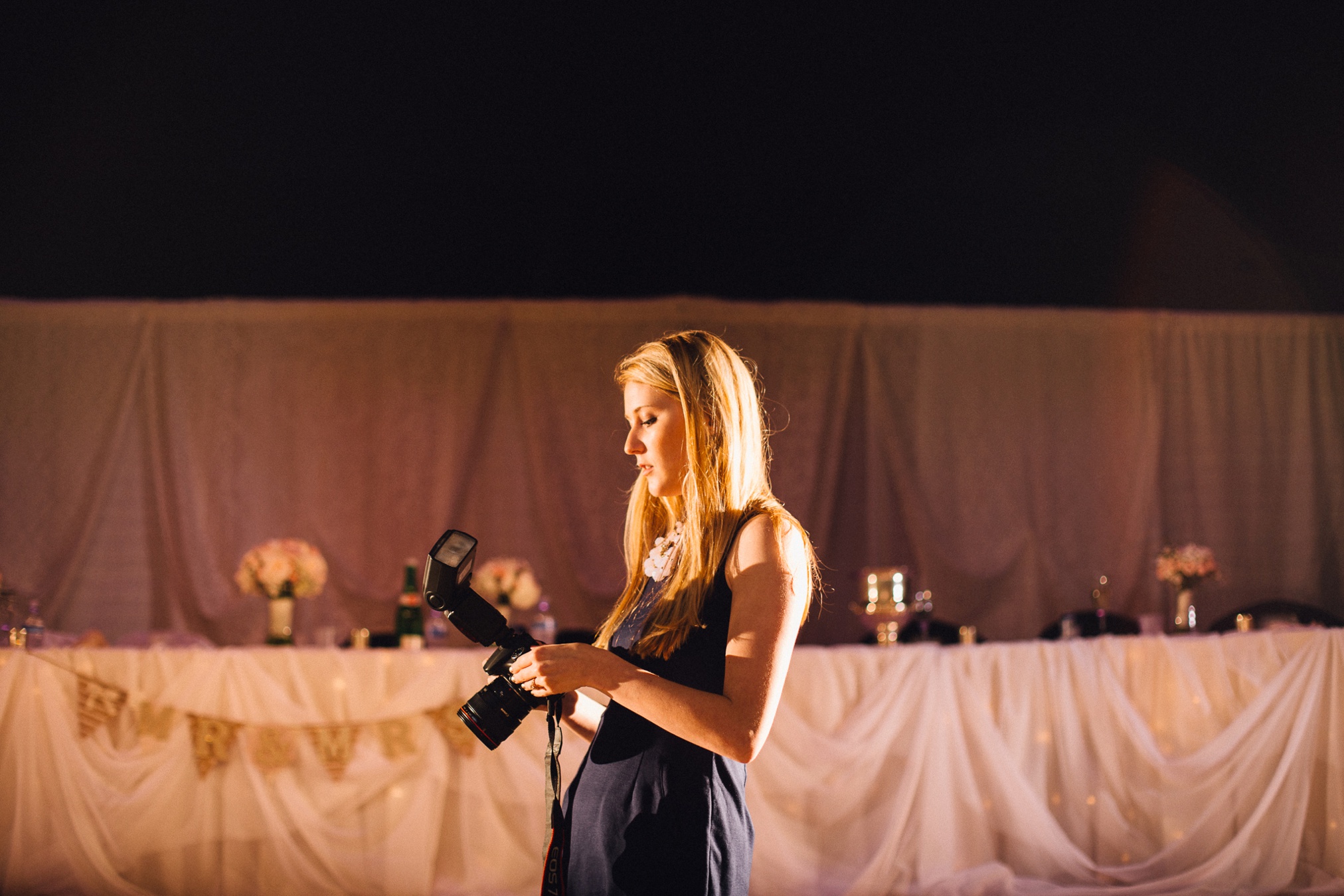 "Elena, go stand over there casually so I can grab a test shot for lighting."