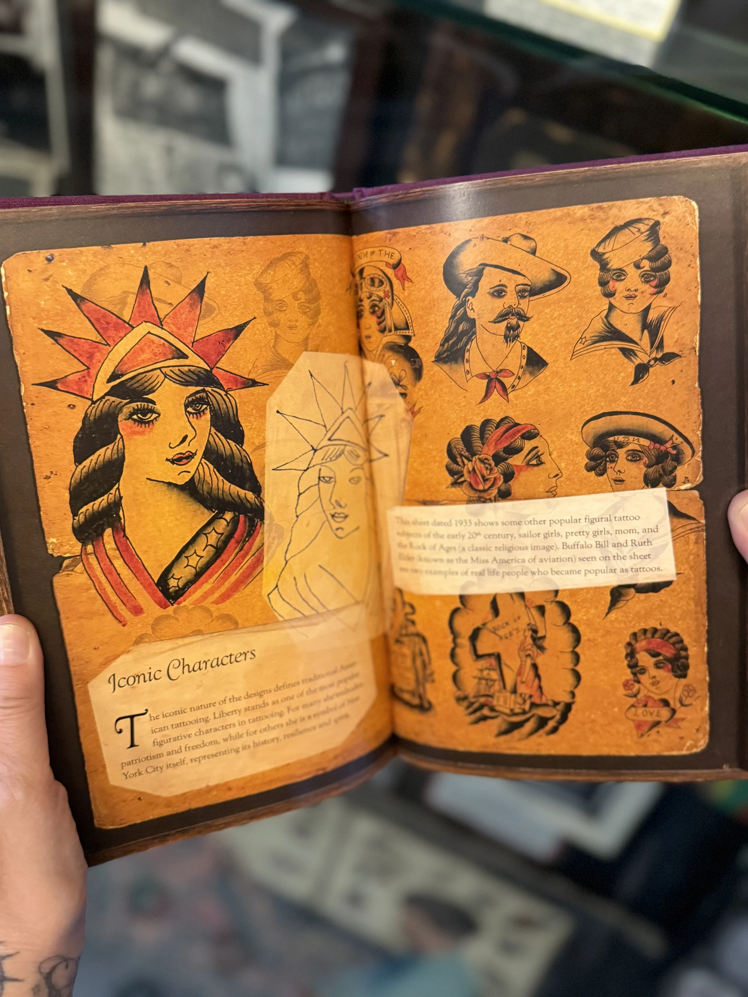 Detail of Liberty the Tattooed Lady book with photos of Liberty traditional tattoos