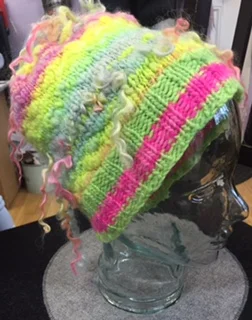 Handspun yarn hat with bits of Manos del Uruguay Maxima used