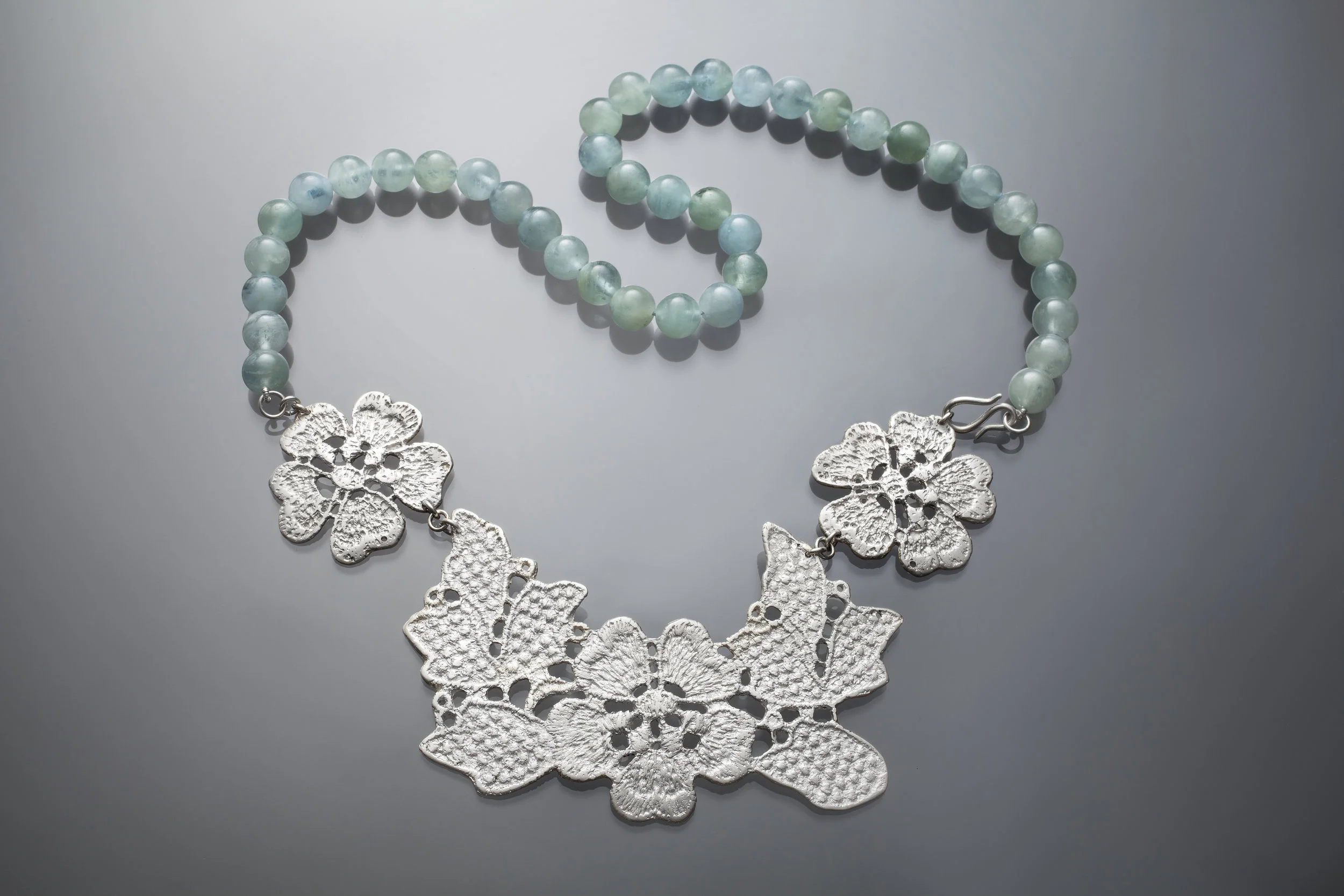 lace flower bib necklace with aquamarine beads