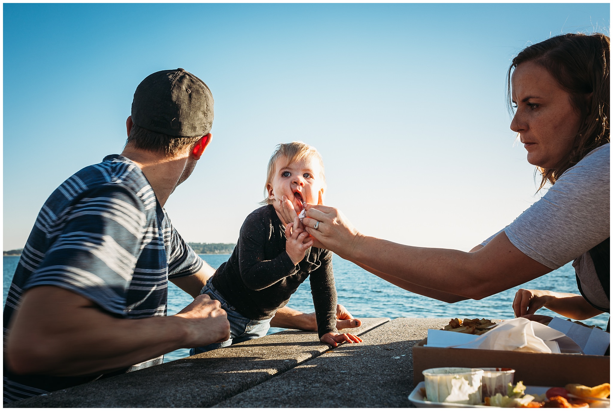 Toddler sitting on picnic table