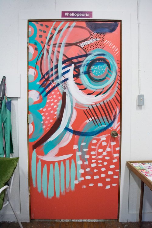  Jaci painted the door to her studio in the style of her paintings. 