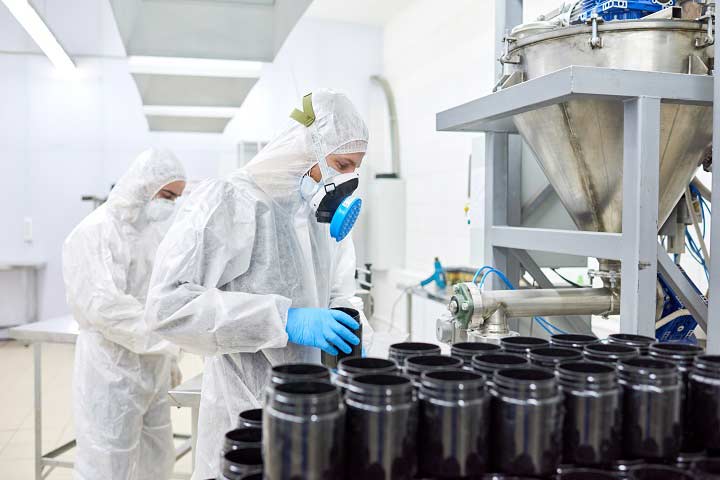 Biotech workers processing assays and other inventory.