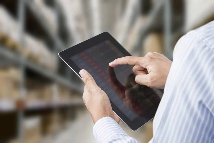 Using a tablet to show asset locations in a warehouse.
