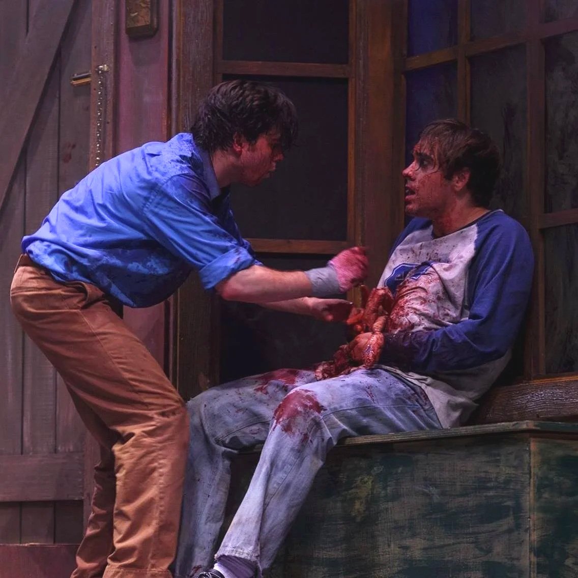  Ash consoling a dying Scott as his intestines get pulled out of his torso. 