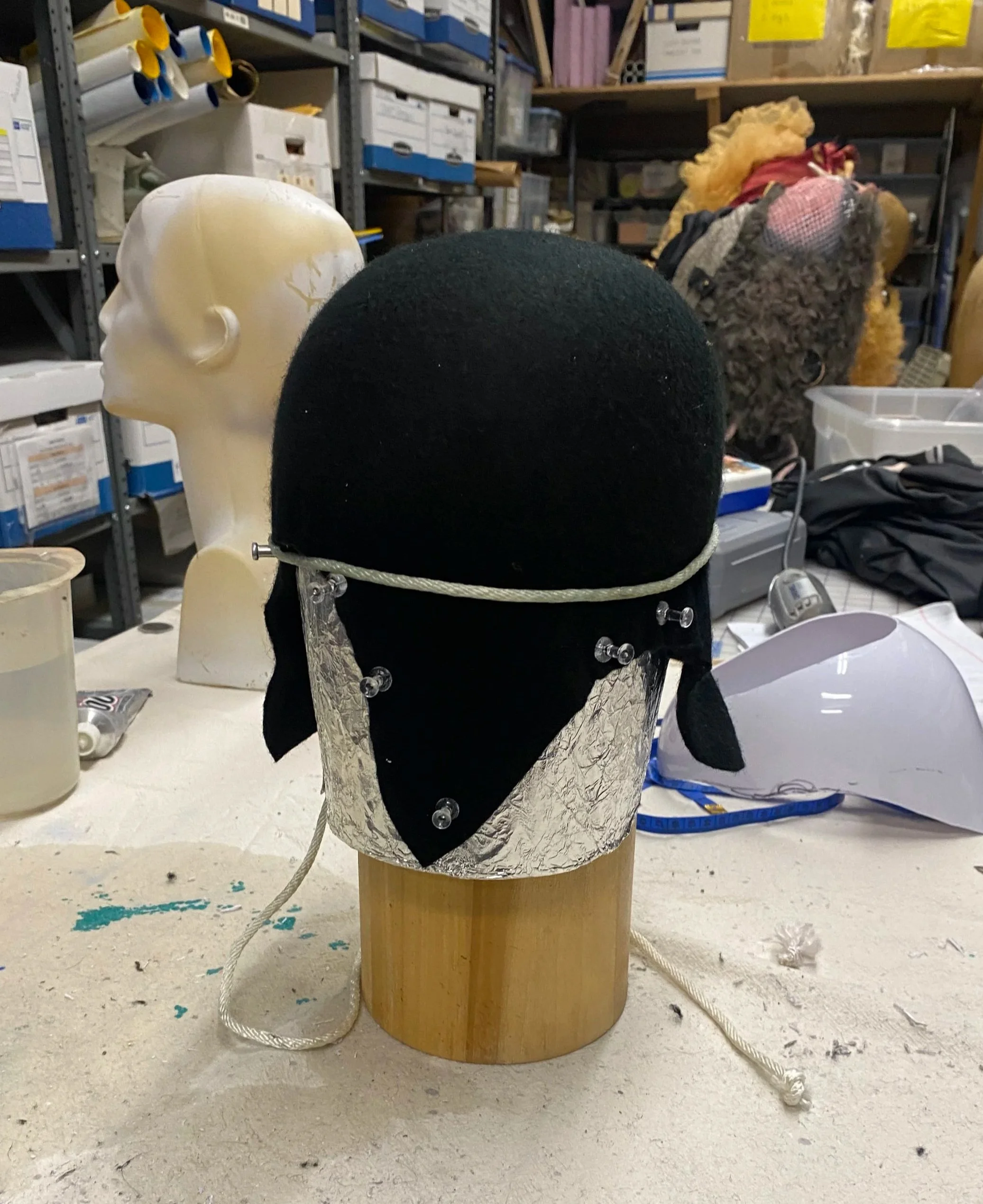  To enhance performer comfort, I blocked thick wool onto a form and adhered it to the headgear interior, creating a cushioned lining that added some friction for the dancer. 