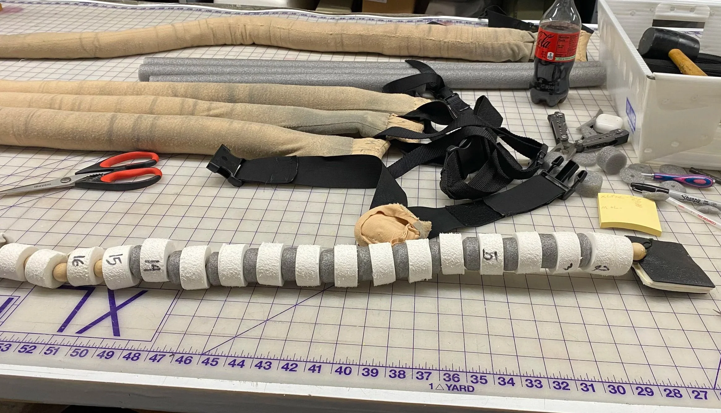  I reconstructed the mouse tails after years of stretching created safety concerns and trip hazards. By replacing compressed foam discs with wooden beads near the tip for natural movement, adding denser foam “vertebrae” in the midsection for structur
