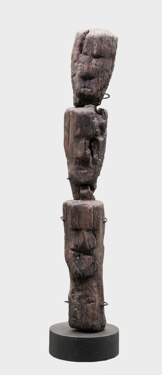 Figure 3.4 Stacked wooden heads from the sanctuary at the source of the Seine. Ca. early first century CE. 70 × 10 × 8 cm. Dijon Archaeological Museum 75.2.80. Photo by François Perrodin, used with the kind permission of Dijon Archaeological Museum.