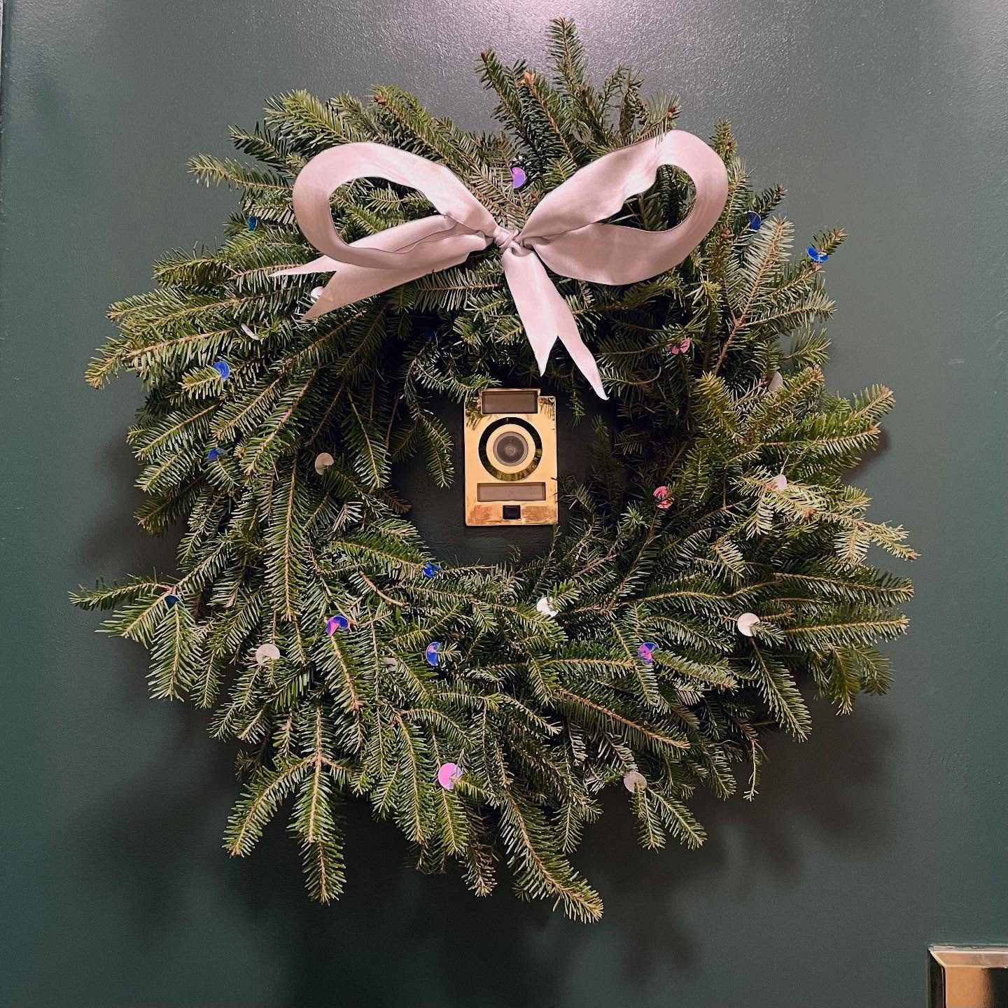 Loving the wreath so much this year it&rsquo;s getting its own post 💜🤍🩷 took the left over vinyl from the snowflake topper and hole punched some extra large circles that I cut slits in ✂️ Just a little sparkle for the natural beauty of the wreath?