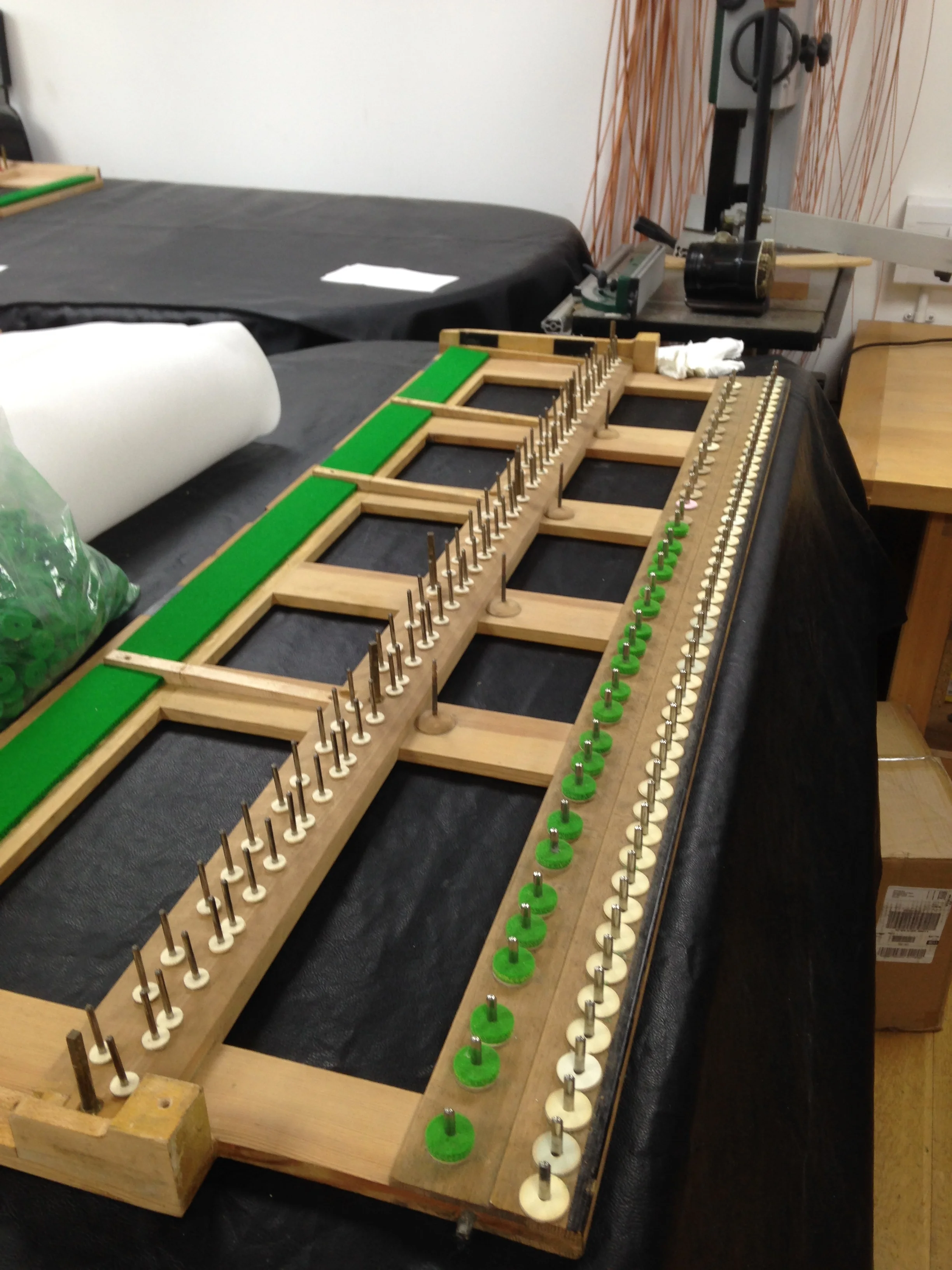 Key frame being restored; old felts removed and fitted with new. Key frame rails cleaned.
