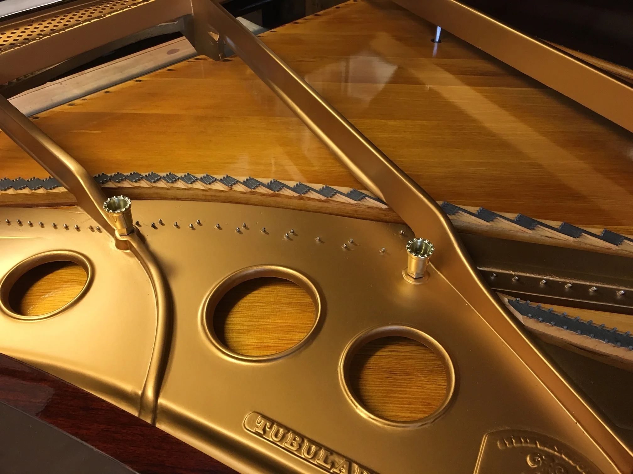 Plate re-gilded, soundboard prepared, prior to stringing.