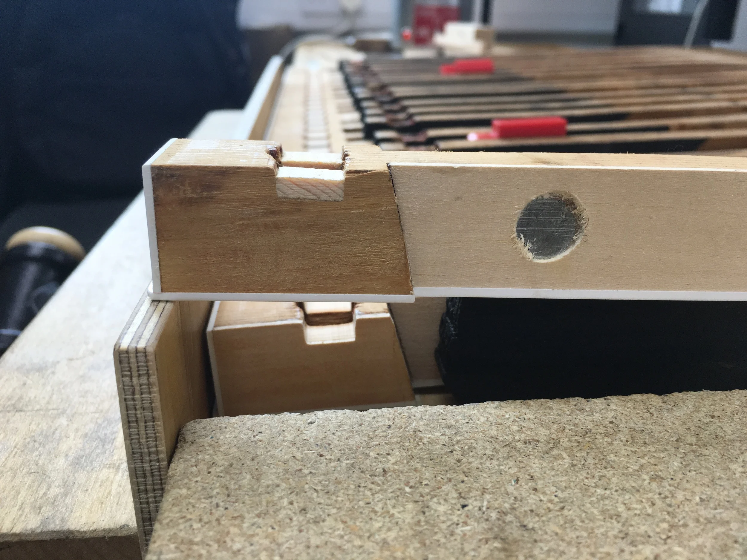 New wood inserted to facilitate correct position of new bushing felts