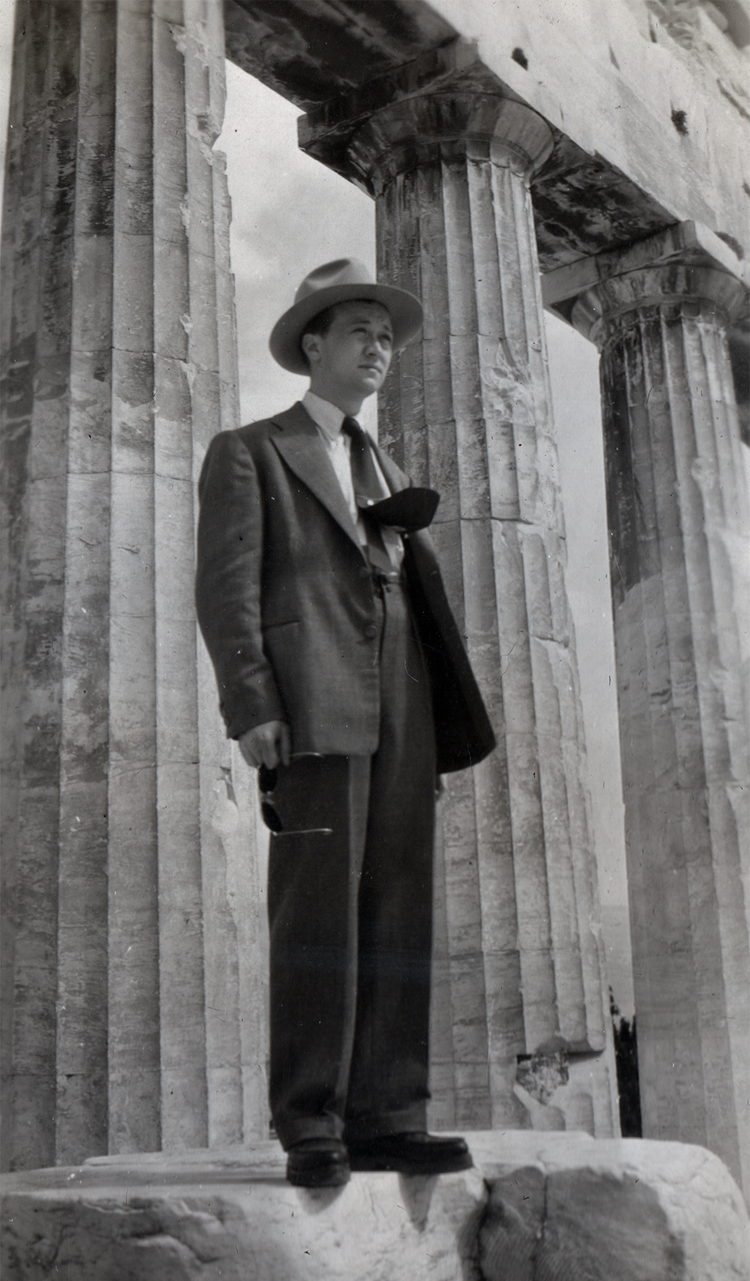 Here he is in Athens, the wind whisking his tie into a jaunty hello to a new life.