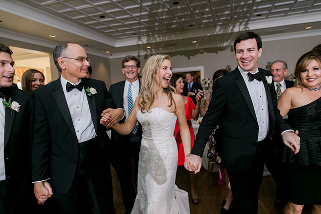 bride and groom dance to the hora