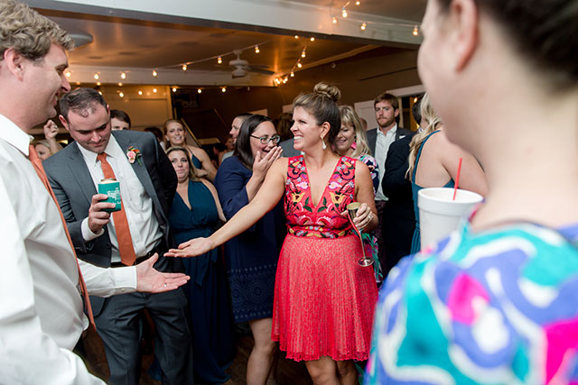 bride changes into cute short reception dress with embroidery detail for dancing