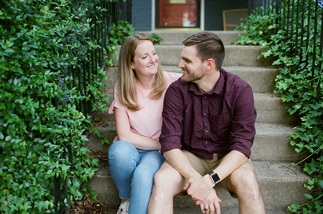 couple laughing on front steps - Sarah Der Photography