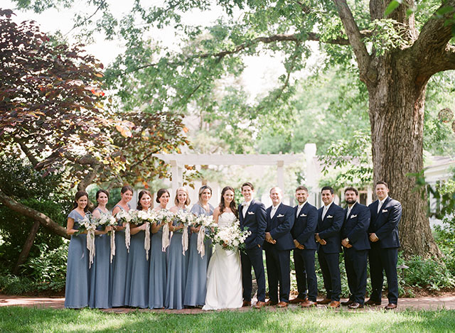 Bridal party lined up outside the fearrington inn - Sarah Der Photography