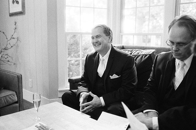 fathers of couple sign wedding certificate - Sarah Der Photography
