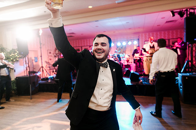 groomsman dancing at reception