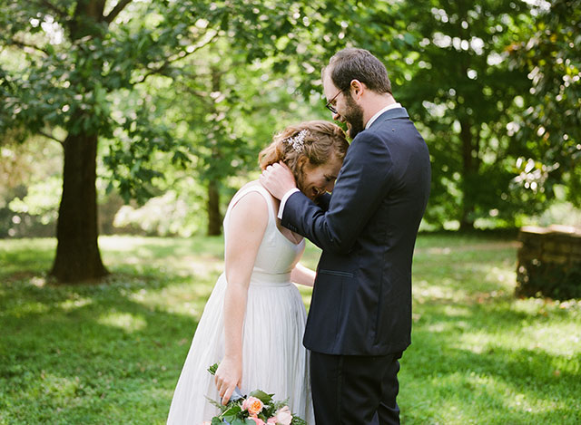 sincere reaction of first look, groom hugs bride - Sarah Der Photography