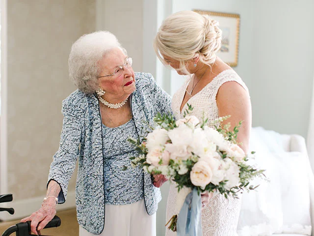 candid moment between bride and grandmother