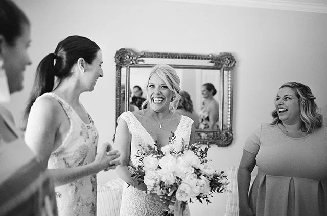 Bride smiles and is excited for wedding ceremony