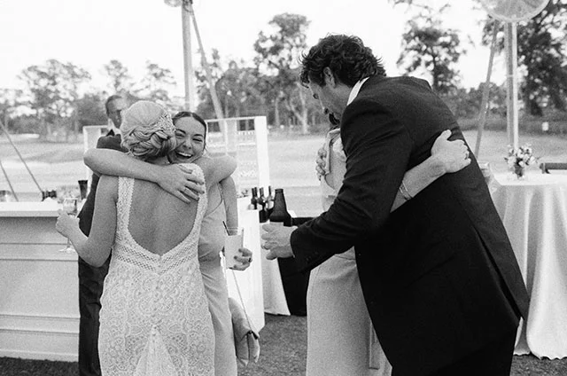 Couple hugs guests