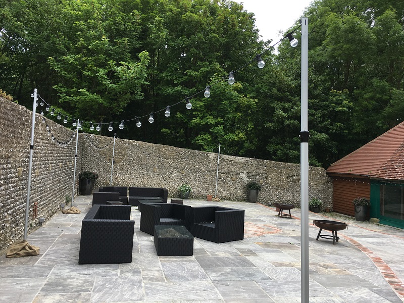 The patio by the bar dressed with our freestanding festoon poles for a festival look! We only wish we could have got a picture at night!