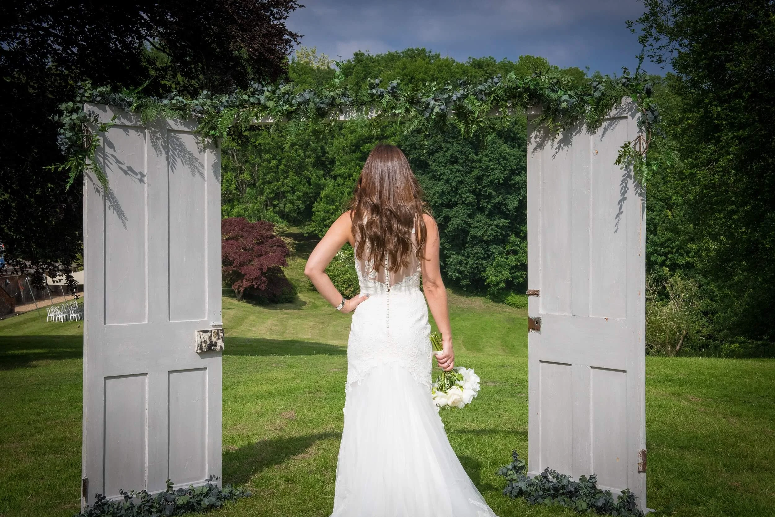 outdoor rustic wedding arch at Robert Denholm House