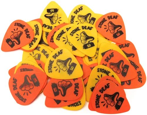 I’ve done design for this wicked english music brand called StoneDeaf started with plectrums , I call them mc-trums , they’re going to be on sell very soon , I use the orange one they go well with my casual rocker looks , feel like getting naked right now .