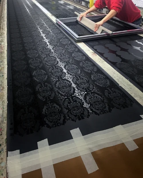 Yes, every single roll of our screen-printed paper is really printed by hand. We do employ other modes of manufacturing, like the incredible digital printing available now as well as hand-painting murals onto archival paper.
