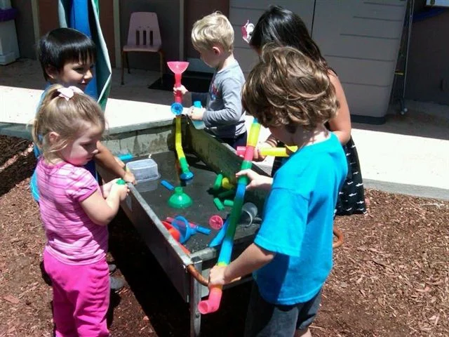 preschool kids in water table.jpg