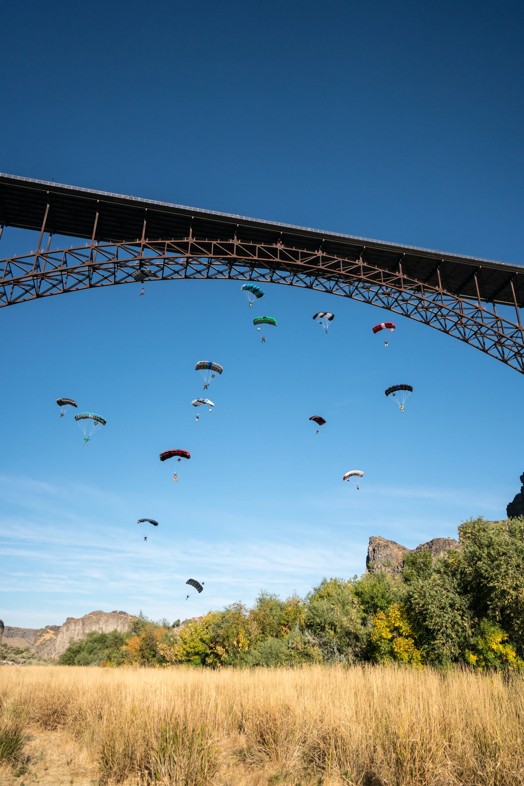 For his 61st jump, Danny and 14 others jumped from the bridge simultaneously so everyone could celebrate in the landing area. Photo by Scott Rogers